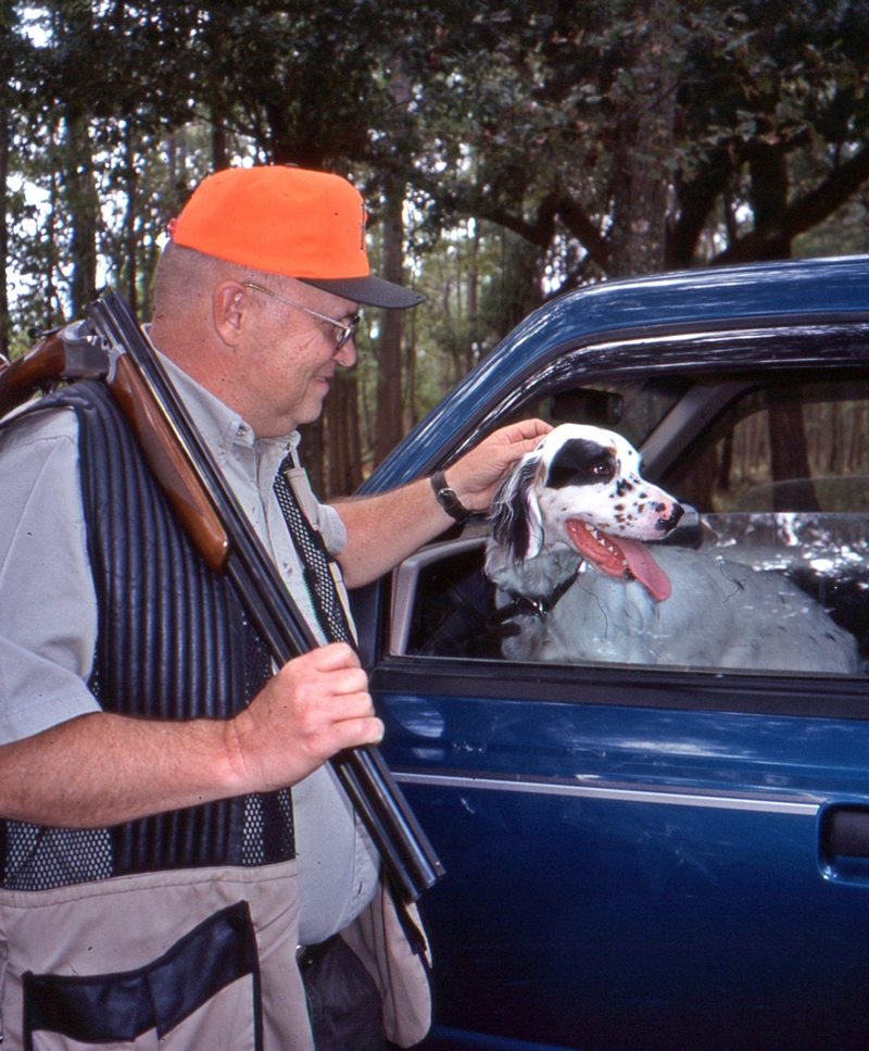 man with dog and gun