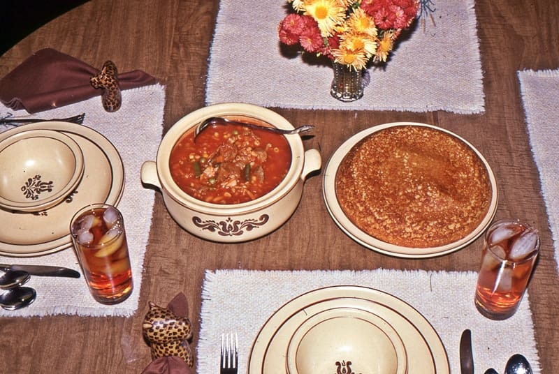 meal of soup and cornbread on table