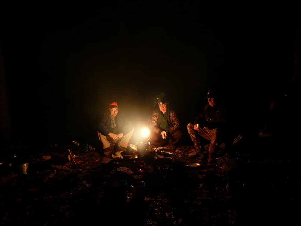 men around campfire