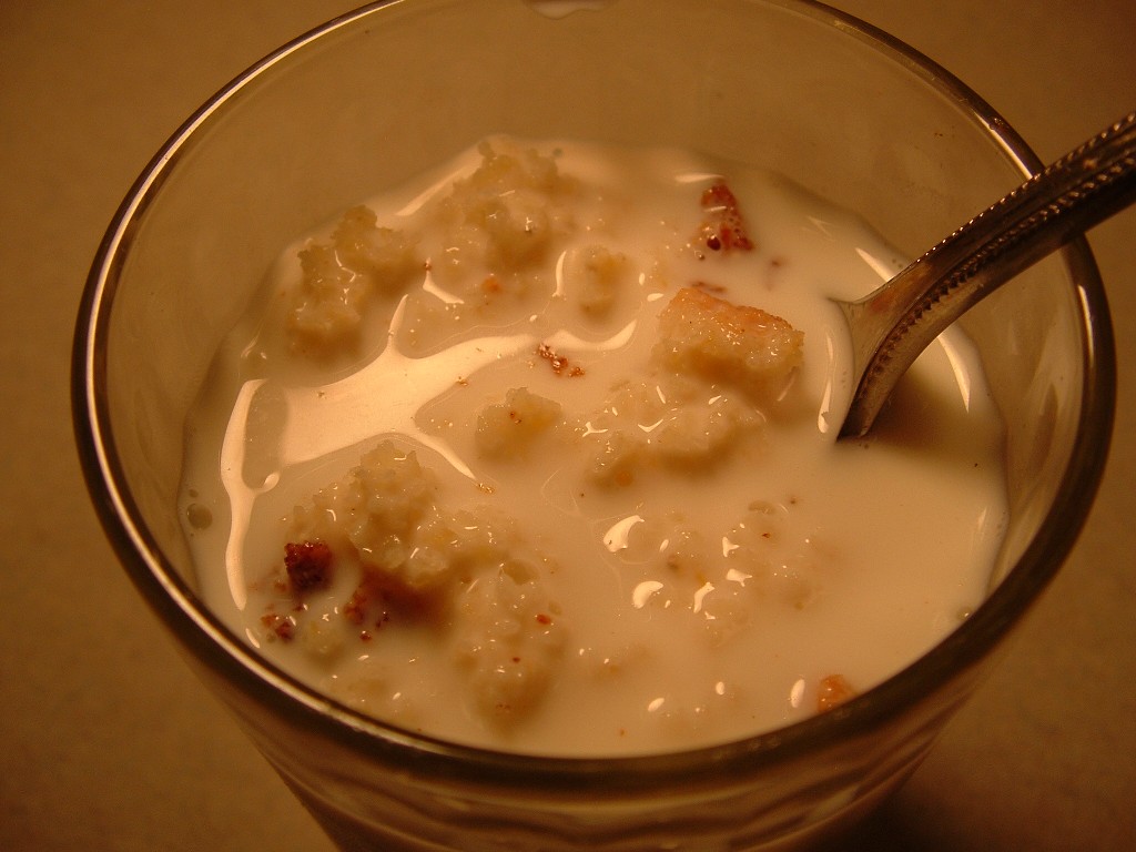 glass filled with cornbread and milk